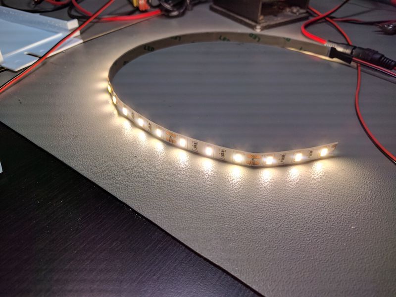 LED strip lit, lying on bench