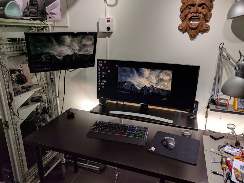 Computer desk with ultrawide monitor on shelf