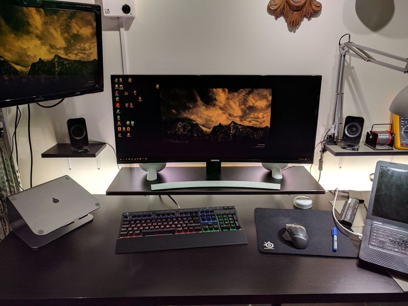 Computer desk with ultrawide monitor and RGB keyboard