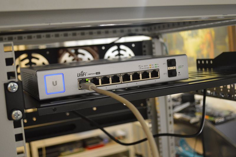 Unifi 8 port PoE switch, on shelf in rack