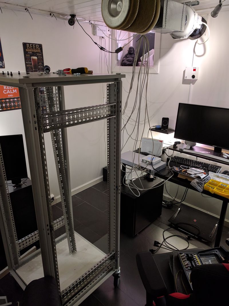 Empty computer rack, switch and router with network cables placed on desk