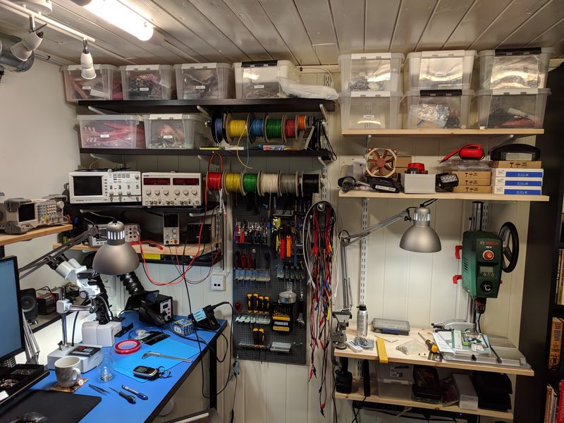 Electronics lab, with part storage, tools, drill press, wire spools, etc