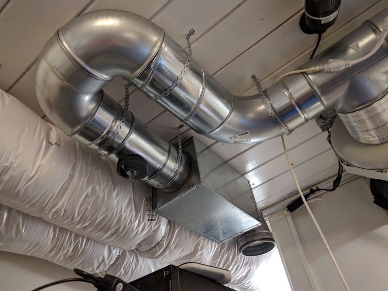Exhaust ventilation system, with valve, noise trap, and ceiling intake