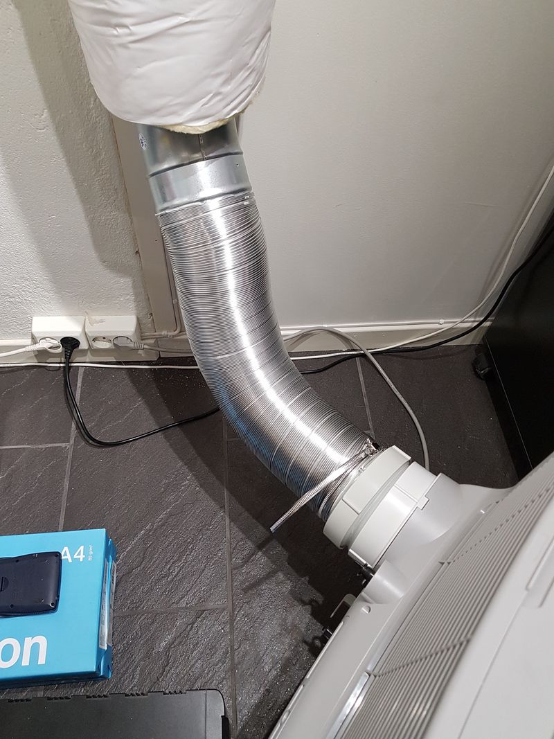 Portable AC exhaust connected to insulated duct with flexible hose