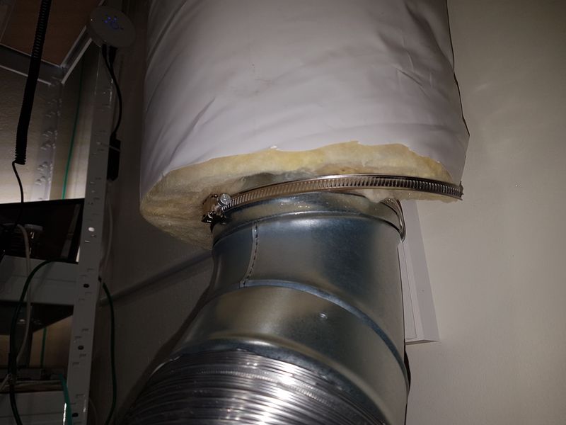 Hose-clamp securing insulated ventilation duct to wall
