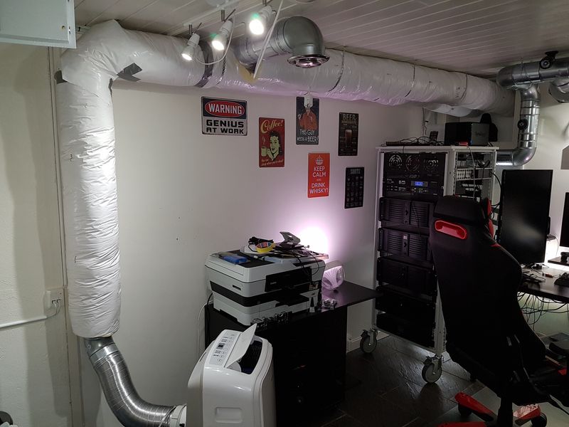 Home office with server rack, portable AC and insulated ventilation ducts