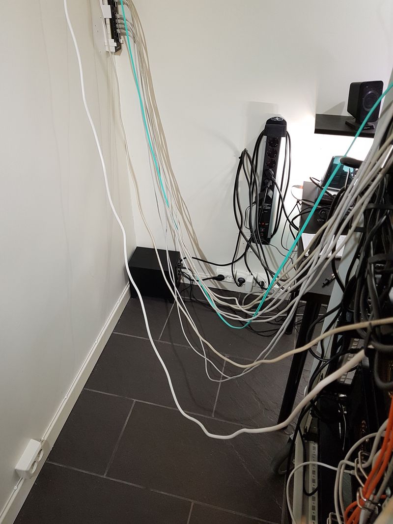 Power and network cables to and from the homelab rack