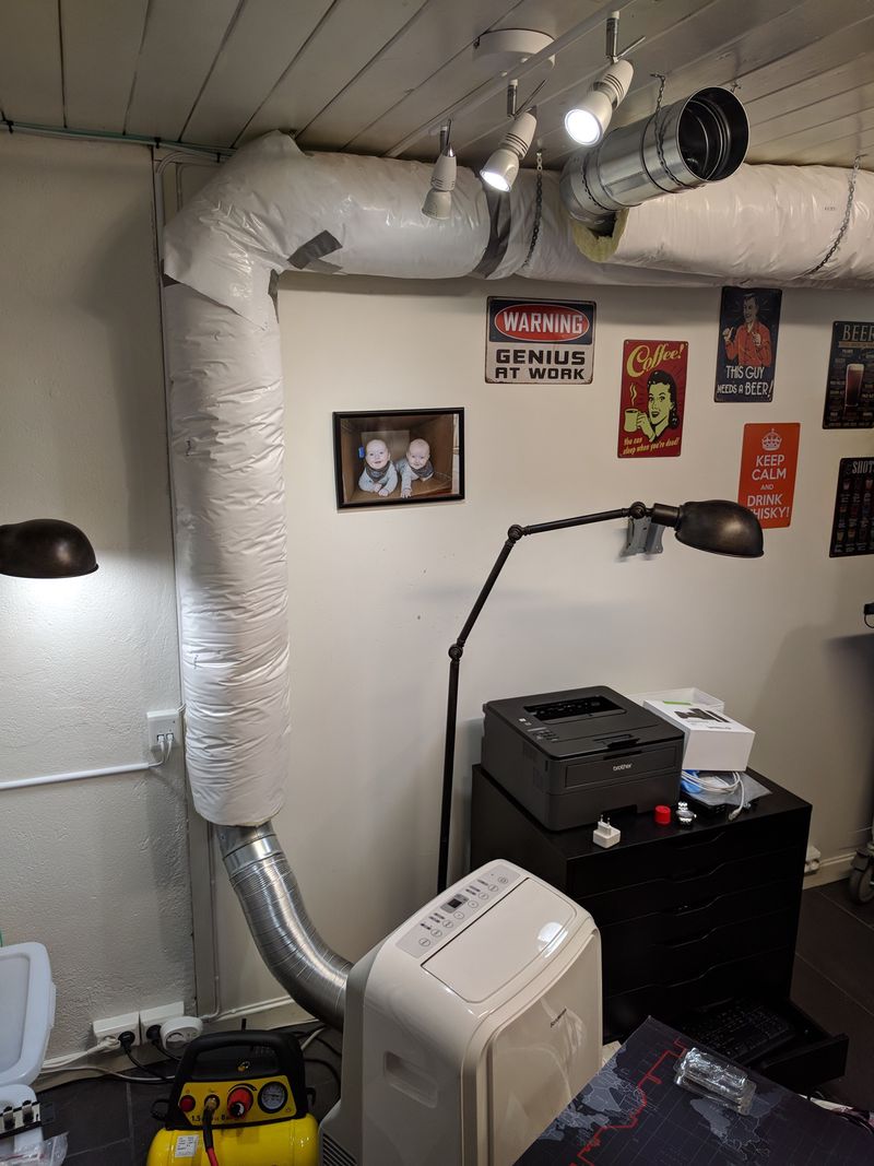 Portable AC connected to an insulated duct. Fresh air intake under the ceiling