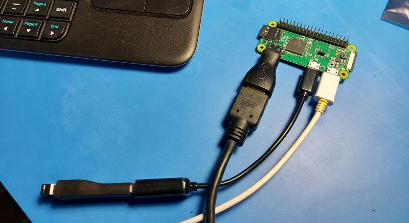 Raspberry Pi Zero with mini-HDMI and micro-USB adapters; and power