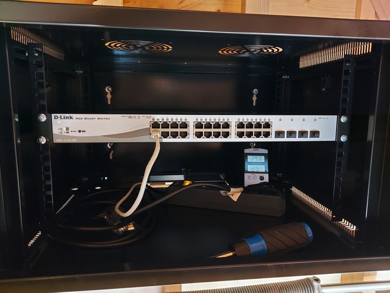 D-Link PoE switch and surge protector in rack cabinet