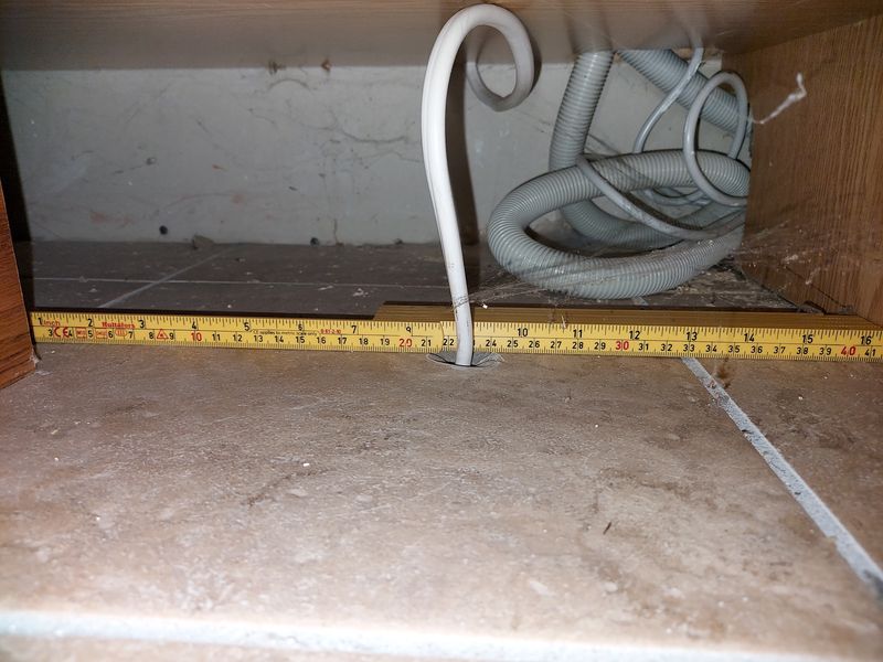 Power cable from basement, exiting under the kitchen base cabinets