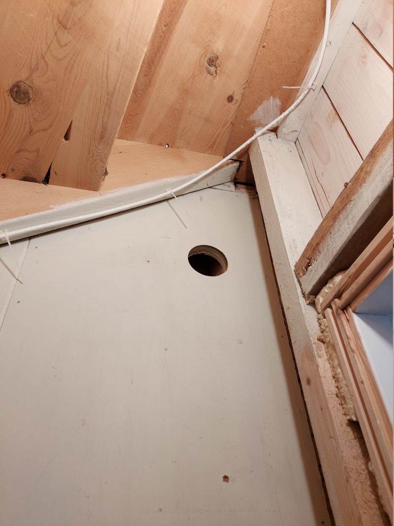 73 mm hole in basement stairwell wall