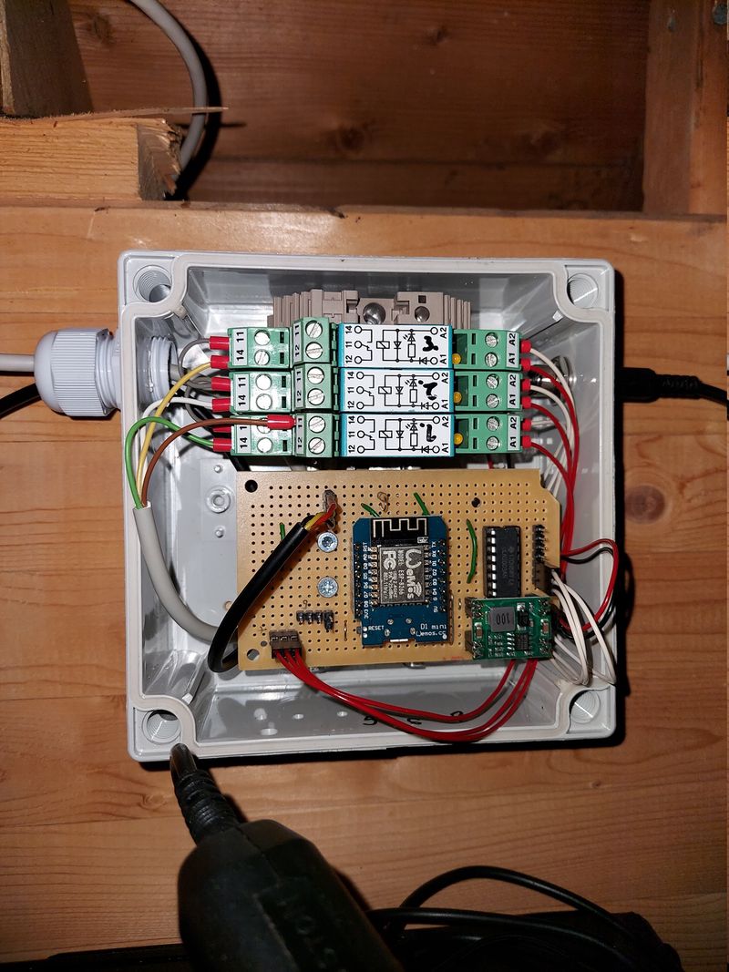 Relay controller installed in the attic, connected to ventilation unit