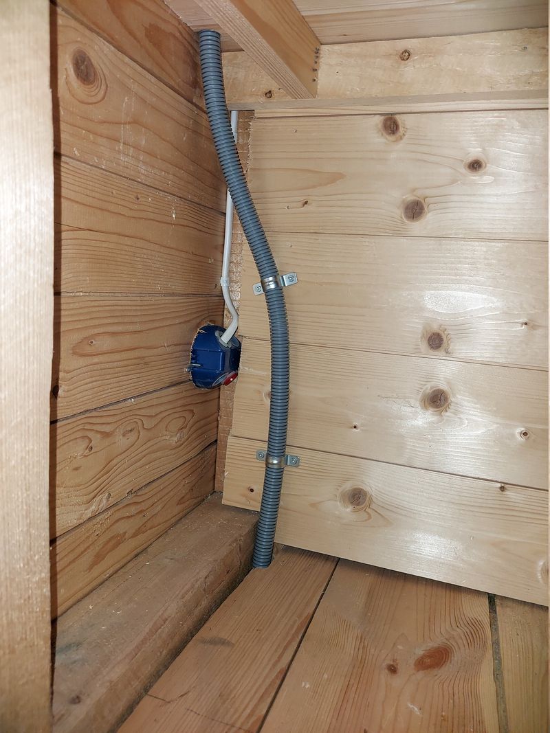 Flexible conduit fastened in 2nd floor closet