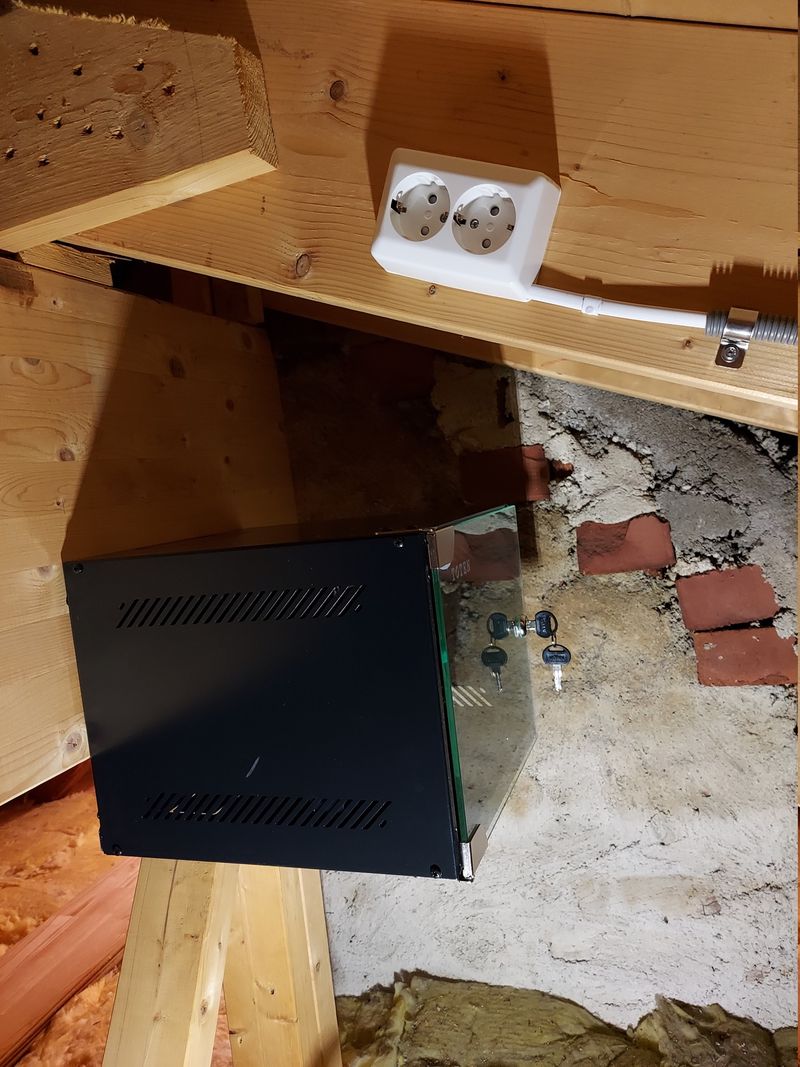 Wall cabinet mounted in the attic