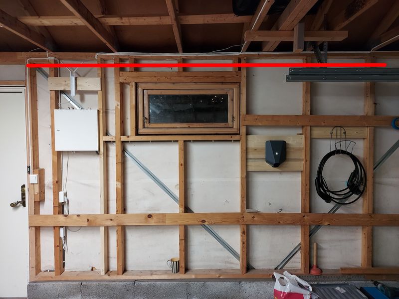 Initial placement of UAP-AC-M in garage — steel gutter marked with red line