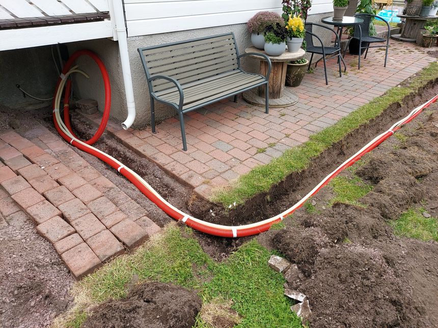 Underground conduits to garage and shed